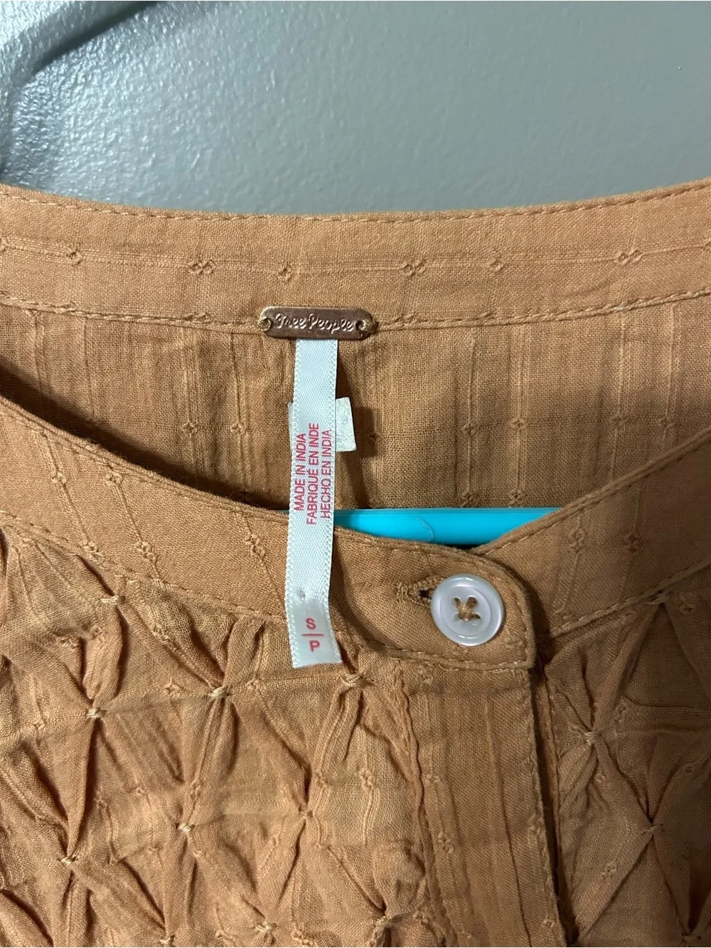 Free People Marigold Button Down Top in a burnt orange color